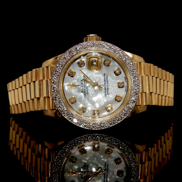Lady's 18k Gold Rolex With Diamonds