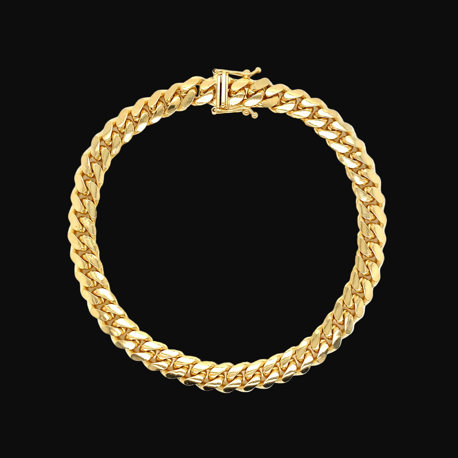 Gold chain bracelet on a white background
