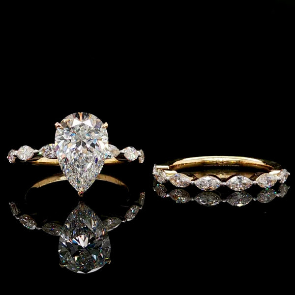 Pear Cut Diamond Engagement Ring with Marquise Band