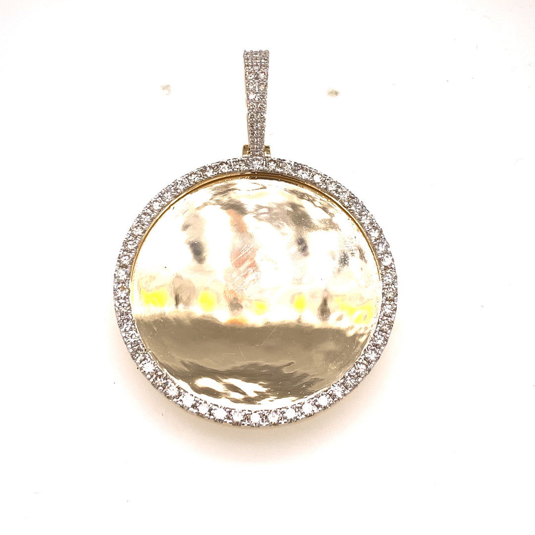 Yellow gold and diamond photo pendant.