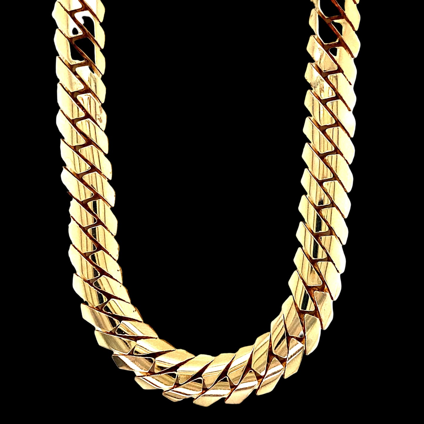 A tight linked cuban link chain. 10MM; 14 karat yellow gold.