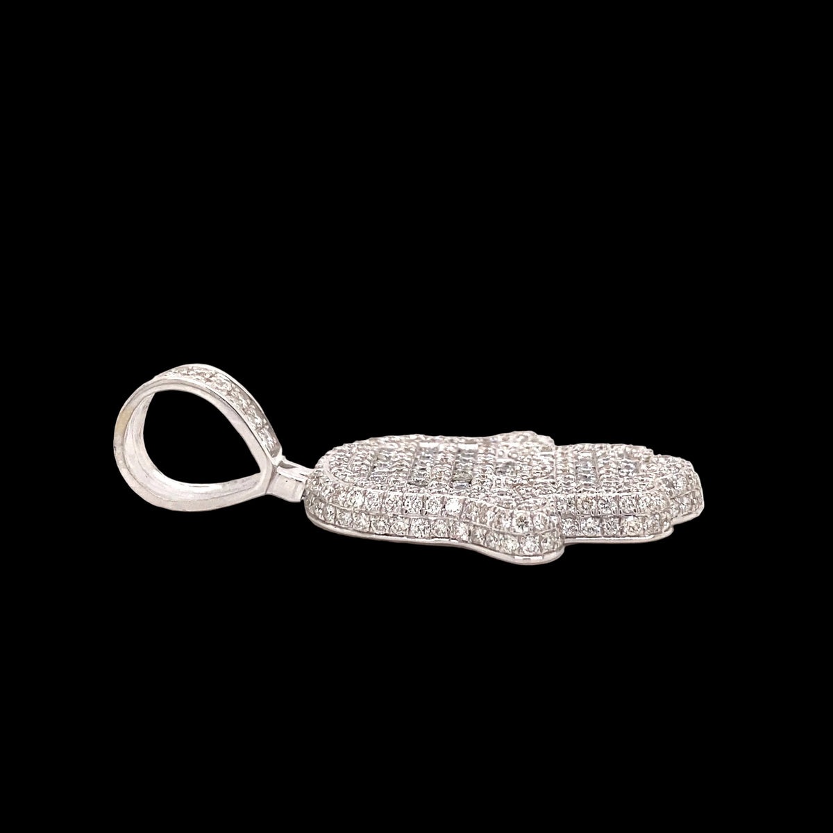 White gold diamond Hamsa pendant laid down.