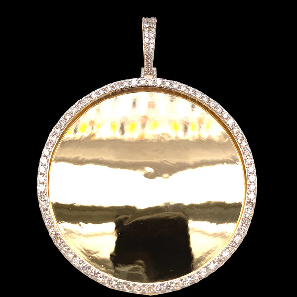 Large yellow gold and diamond photo pendant.