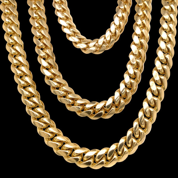 Three yellow gold Cuban chains.