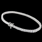 A white gold tennis bracelet with lab diamonds, featuring a series of connected diamond segments on a linked chain.