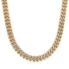 Gold necklace with diamond accents on a white background