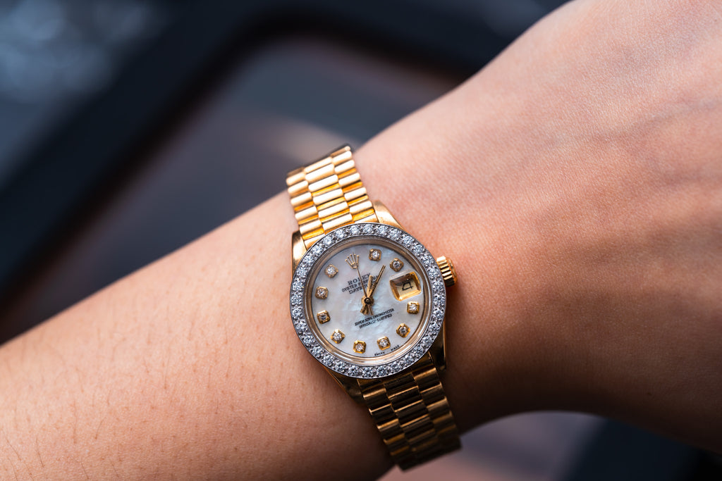Lady's 18k Gold Rolex With Diamonds