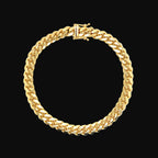 Gold chain bracelet on a white background
