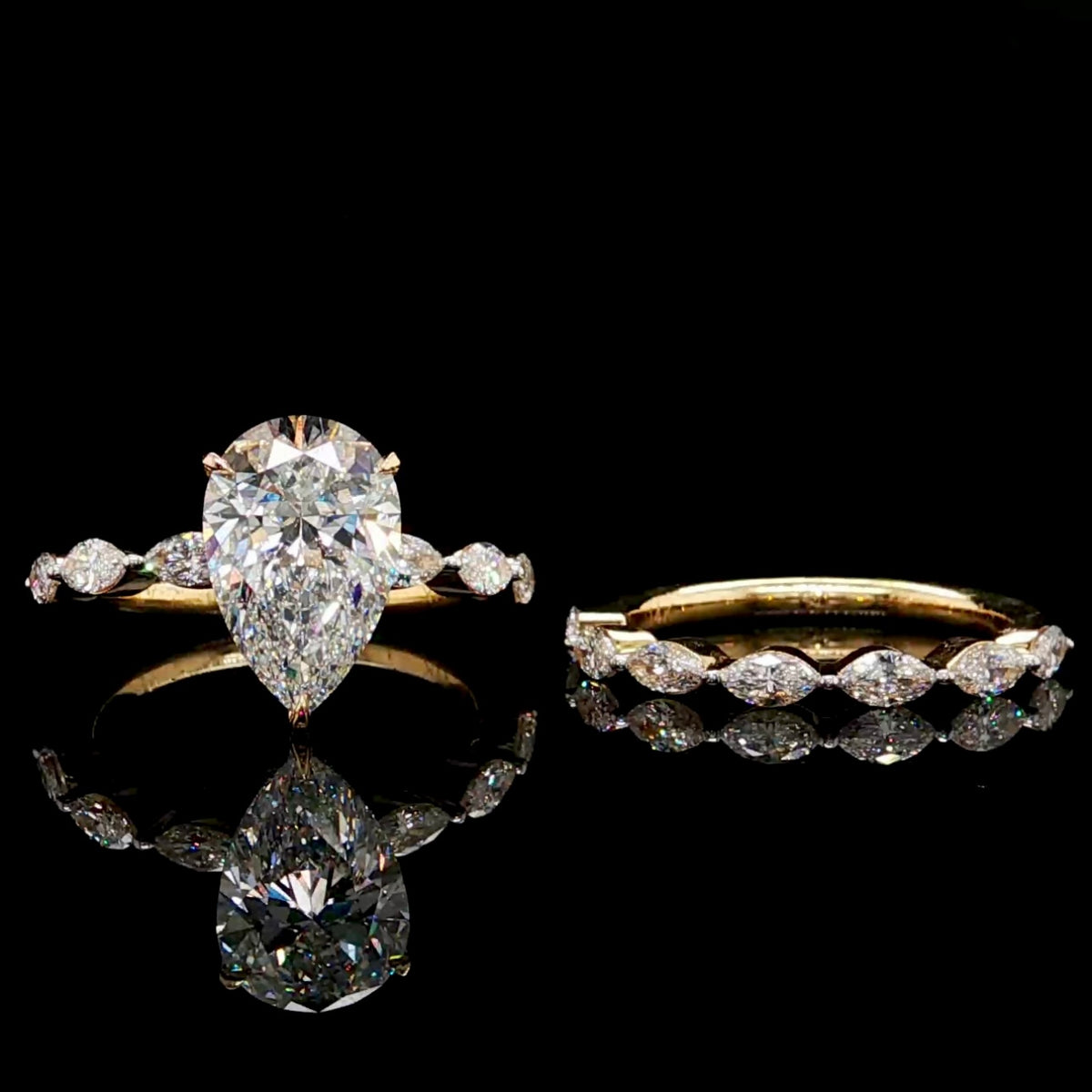 Pear Cut Diamond Engagement Ring with Marquise Band