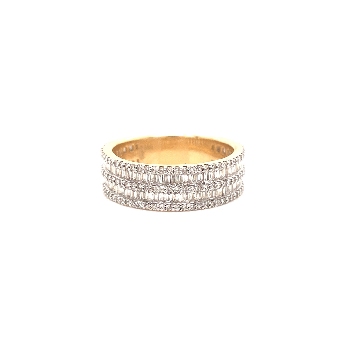 Handcrafted 14k gold, this ring features channel set diamonds that have a combination of baguette and round cut diamonds. 