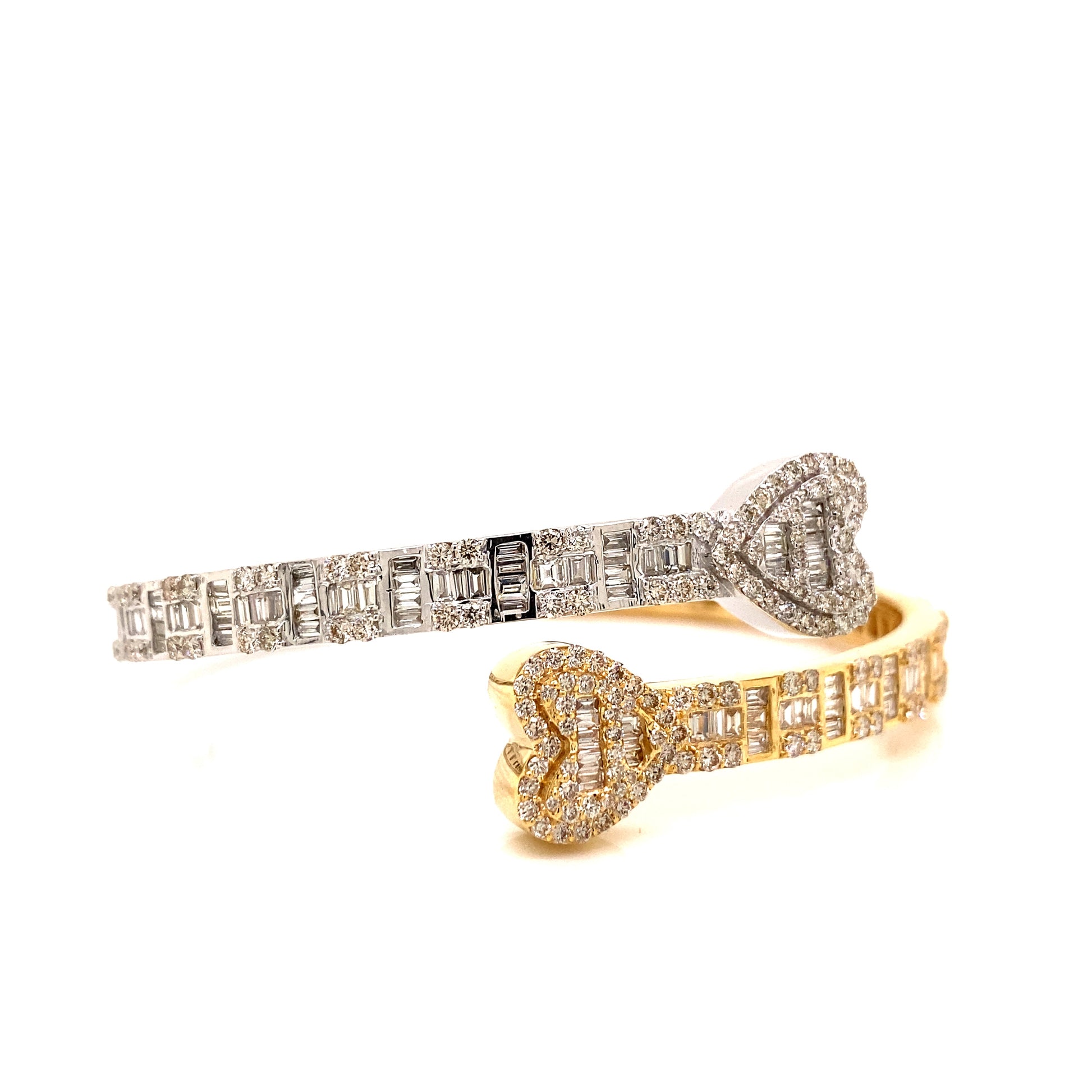 White and yellow gold bangle with white stone diamonds.