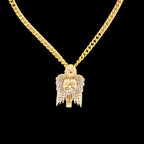 Gold Cuban chain with gold Cherub angel and diamonds.