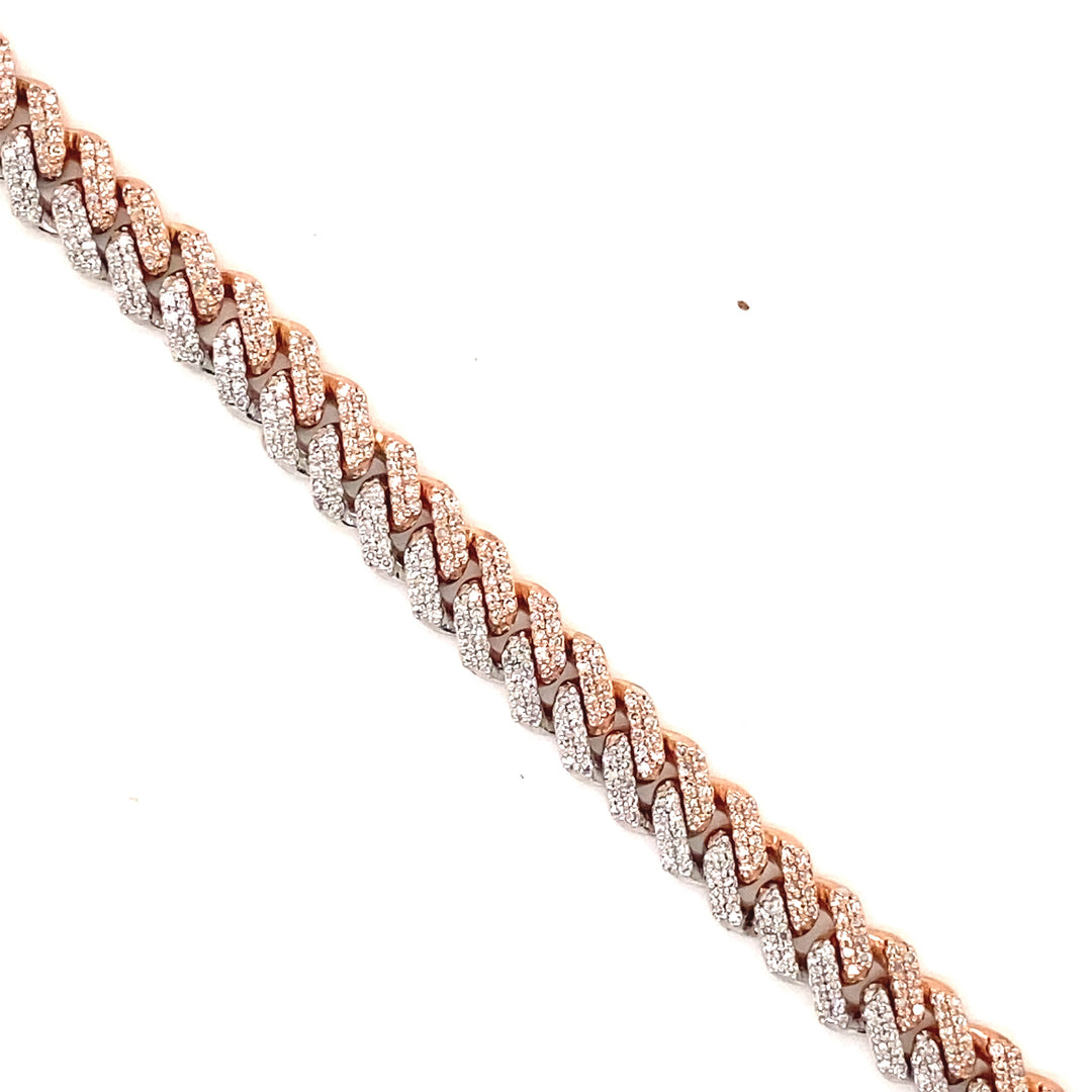 Built in both white and rose gold, this Cuban link bracelet has white diamonds throughout.