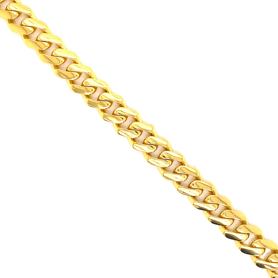 This Cuban Link anklet is handcrafted in semi-solid 14k gold and is 9 millimeters wide.