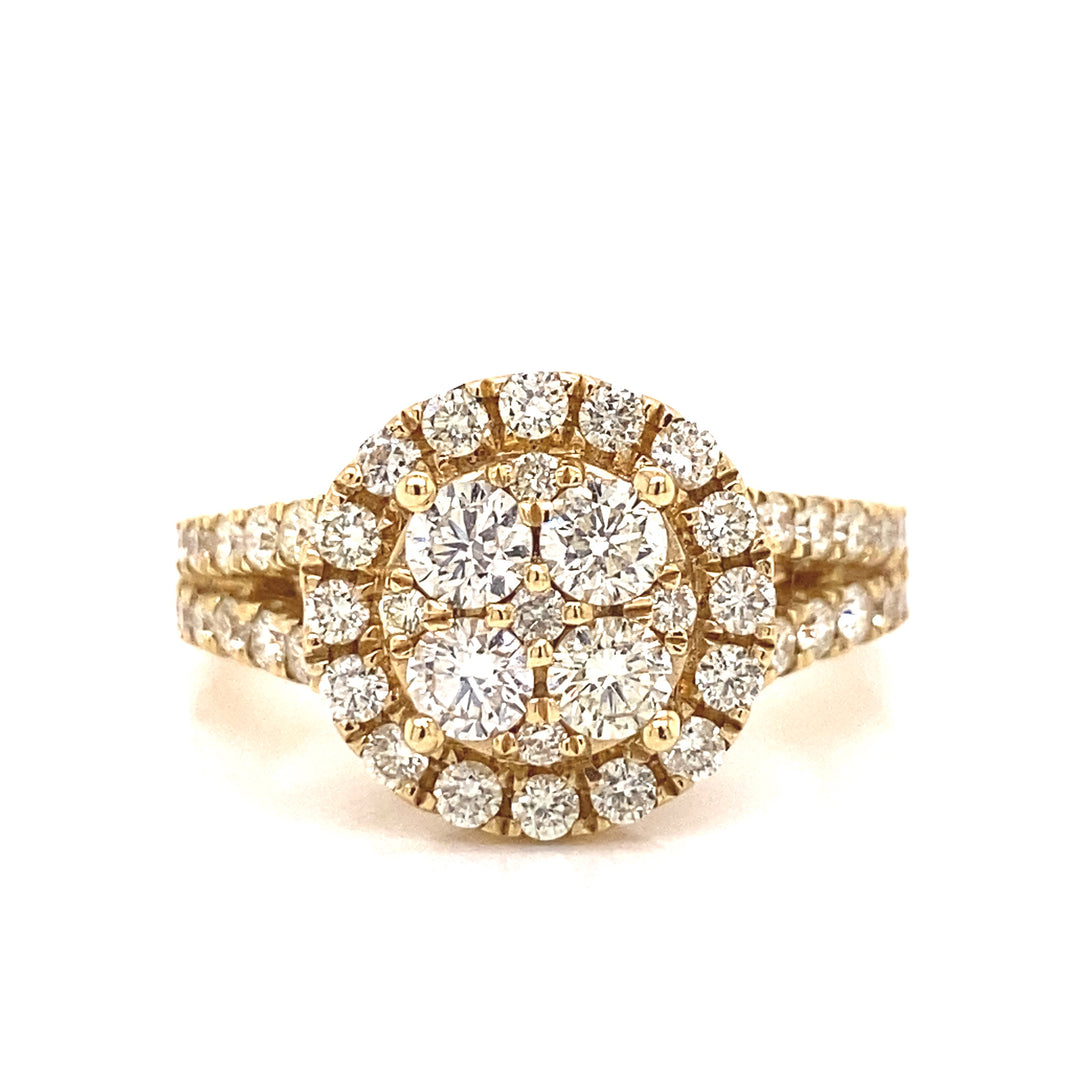 Diamond halo ring based on yellow gold with four large round-cut diamonds held by gold button prongs.