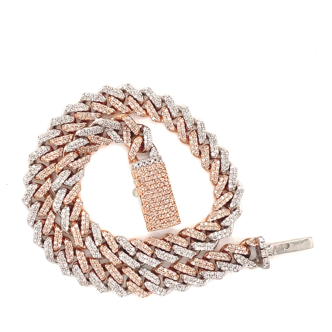 This Cuban bracelet is secured by a rose gold lock that has pave style diamonds throughout. 