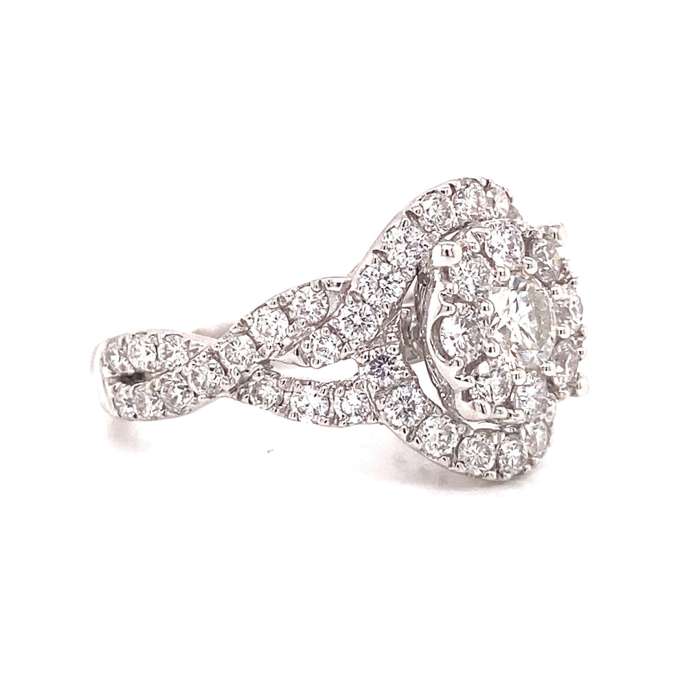 Featuring a criss cross diamond band, this ring is built on solid 14 karat gold. 