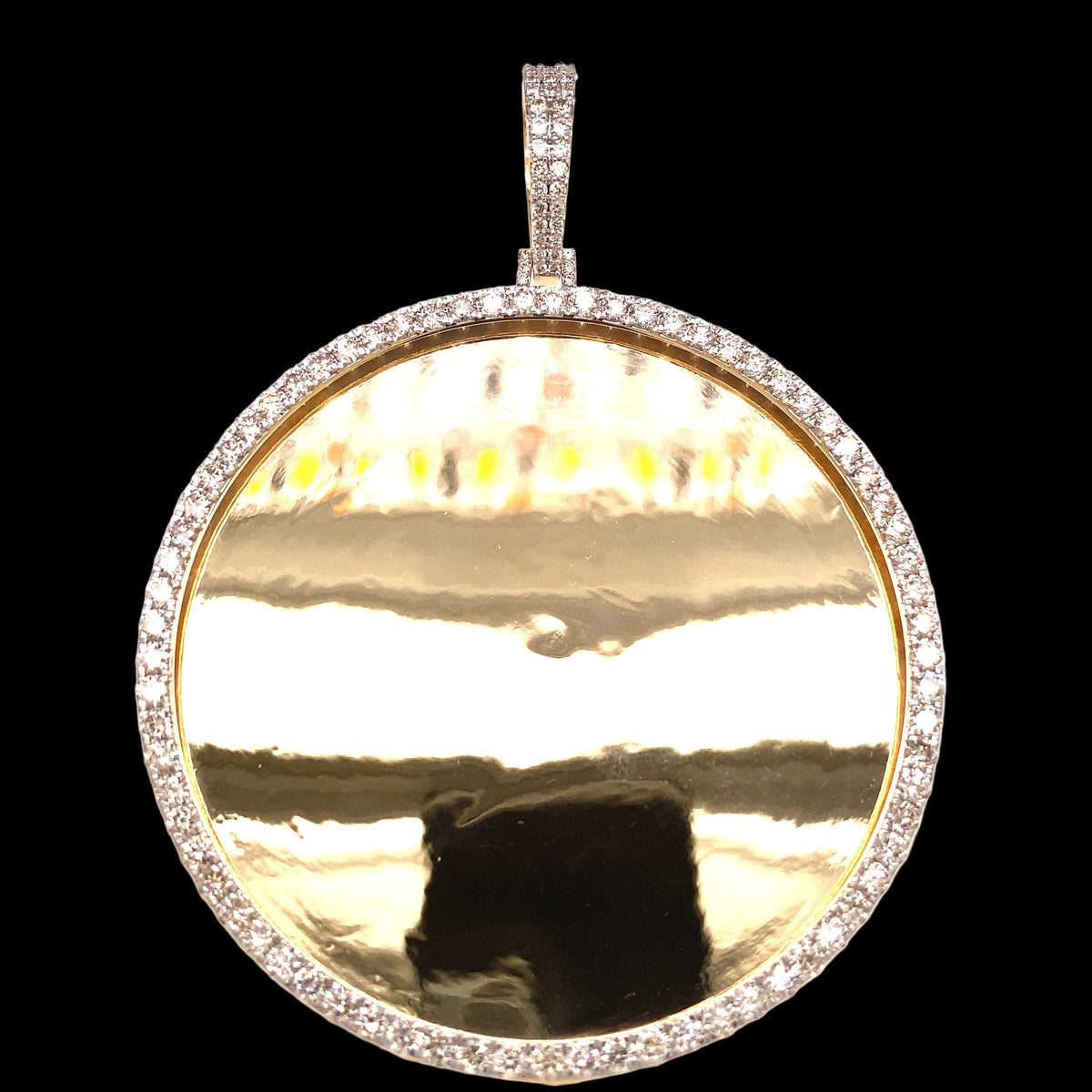Large yellow gold and diamond photo pendant.