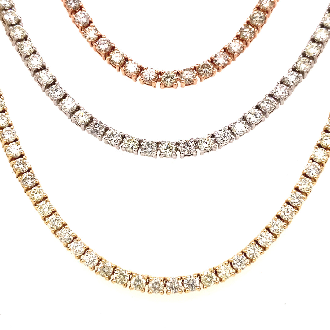 Top chain is rose gold and diamonds tennis chain. Middle is white gold and diamond tennis chain. Bottom is yellow gold and diamond tennis chain. 