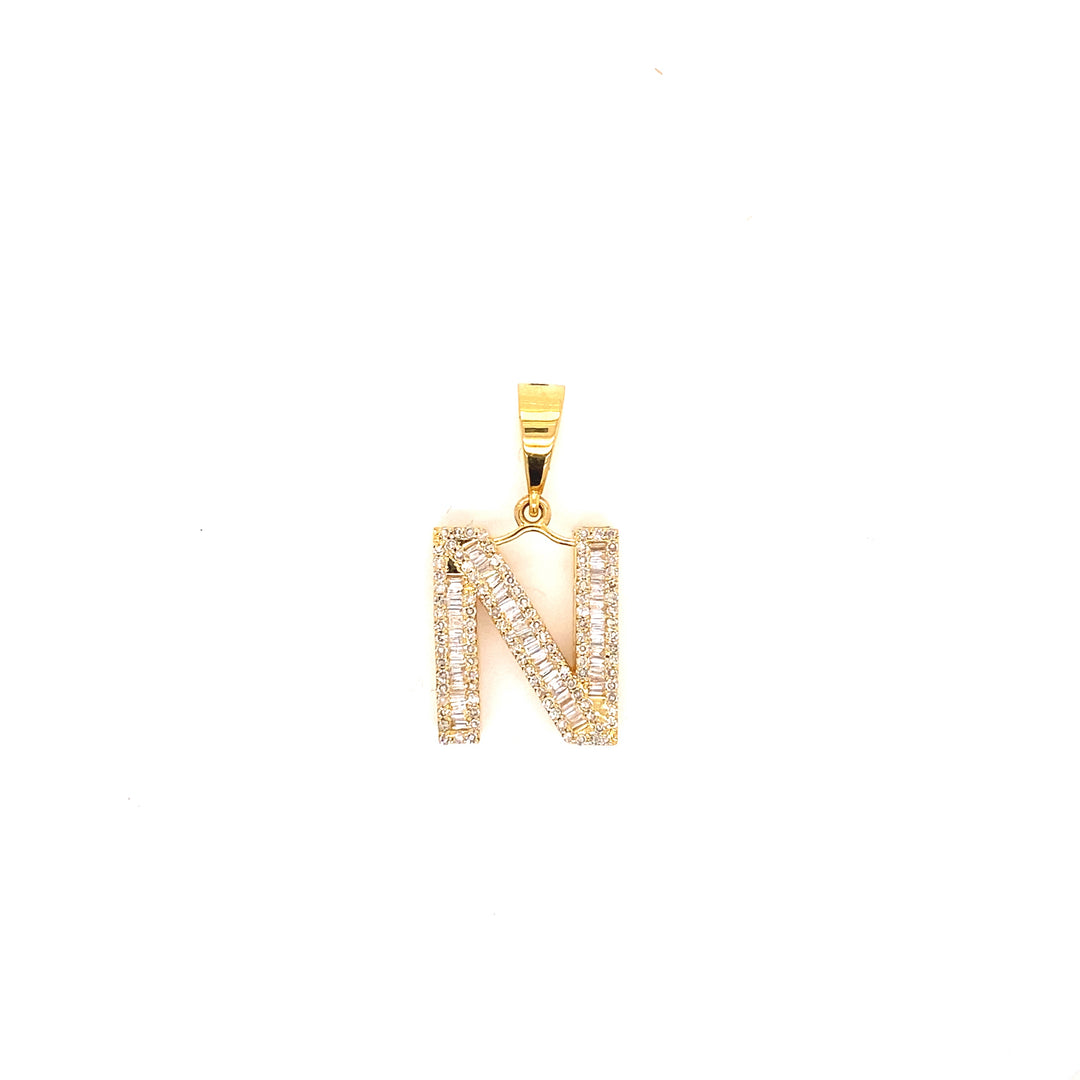 Letter N initial diamond pendant in yellow gold. 