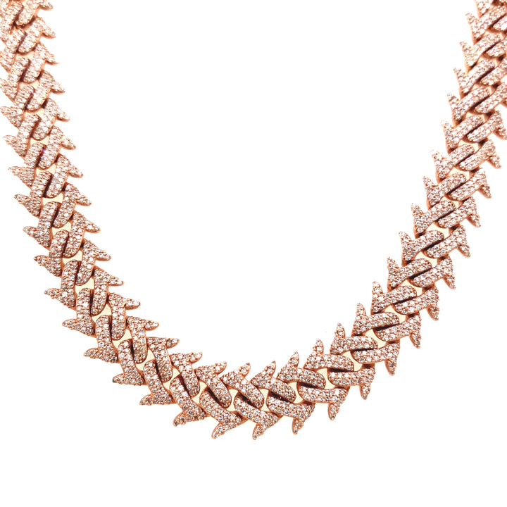 This Cuban Link chain is based on solid rose gold, and is finely detailed with diamonds. 