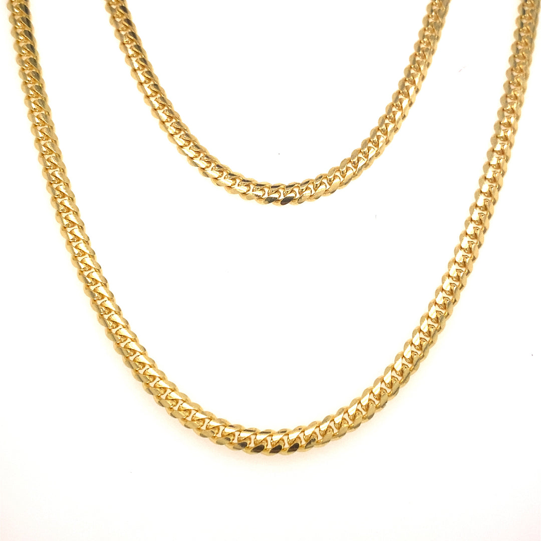 Yellow gold tight link Cuban chains.
