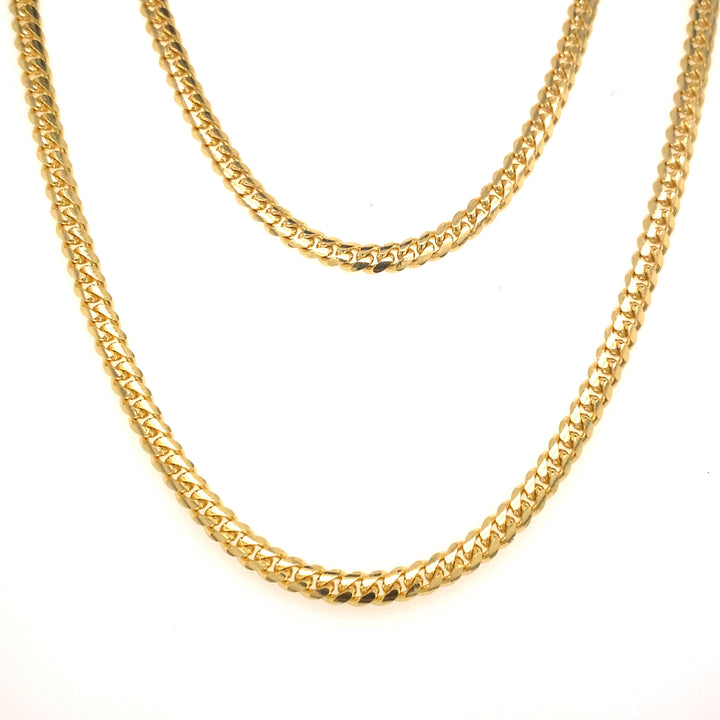 Yellow gold tight link Cuban chains.