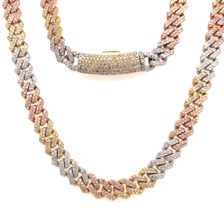 Tri-color diamond Cuban necklace. The gold is made up of white, rose, and yellow, and is finely detailed with white diamond stones. 