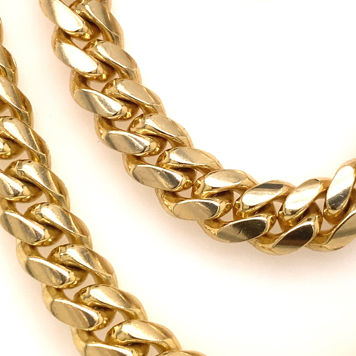 Two yellow gold Cuban style chains.