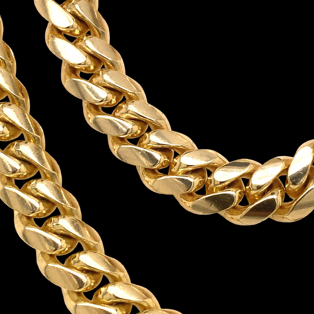 Two yellow gold Cuban style chains.