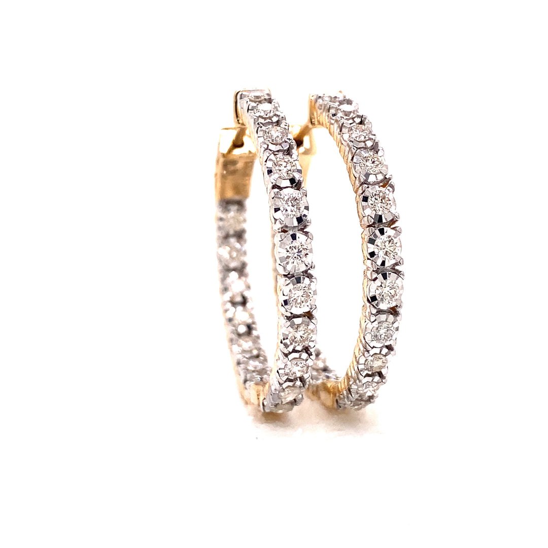 Yellow gold white VS clarity diamond bezel set with button prongs on the hoop earring. 