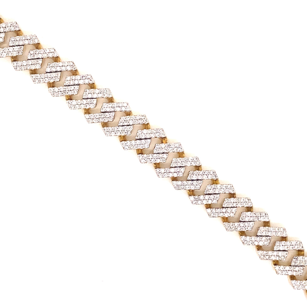 Designed with open links, this Cuban bracelet is based on yellow gold and has pave style diamonds throughout.