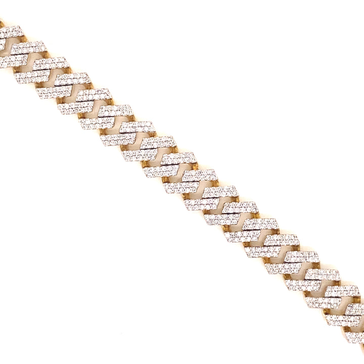 Designed with open links, this Cuban bracelet is based on yellow gold and has pave style diamonds throughout.