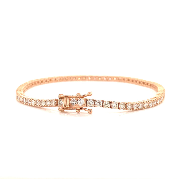 This rose gold diamond tennis bracelet is designed and secured with an elegant box clasp.